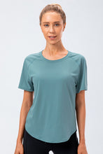 Teal Verzana Active Tee worn during a workout, moisture-wicking fabric.