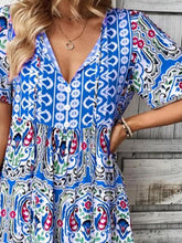 Close-up of Vesaluna Paisley Print Tie Neck Dress in blue, showing intricate paisley print and soft lightweight fabric texture.