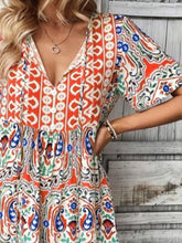 Close-up of Vesaluna Paisley Print Tie Neck Dress in sherbet, showing intricate paisley print and soft lightweight fabric texture.