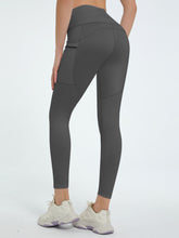 back view of virexaform sculpt leggings in dark gray