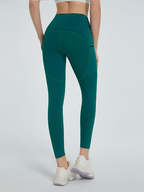 back view of virexaform sculpt leggings in dark green