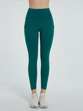 front view of virexaform sculpt leggings in dark green