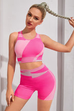 Woman in VitalBlock RiseActive Set front view pose, color hot pink.