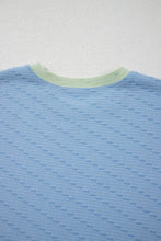 Back view of Knit texture and contrast neckline detail close-up.