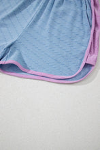 Zoomed-in view of soft stretch-knit fabric and bottom hem trim on Vivenza Luxe™ Shorts.