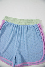 Detailed view of Vivenza Luxe™ Contrast Shorts featuring knit texture and bold contrast hem.