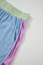 Close-up detail of waistband, contrast trim, and pocket on Vivenza Luxe™ Shorts Set.