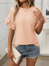 Side profile of model in Contrast Round Neck Short Sleeve Blouse in watermelon pink, styled with casual pants and layered jewelry