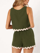 a woman showcasing the back of an Army Green Wavy Mirage Contrast Trim Shorts Set with a white background