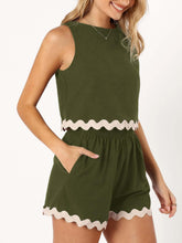 a model wearing an Army Green wavy mirage contrast trim short set with a white background.