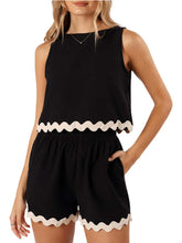 Model front view wearing a black wavy mirage contrast trim short set with a white background.