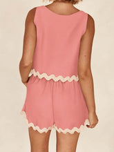 Woman showcasing the back of a Coral Wavy Mirage Contrast Trim Shorts Set with a white background.
