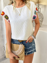 Model styled in white CrochetCharm Top with casual shorts, heels, a brown straw purse, and accessories for a complete look.