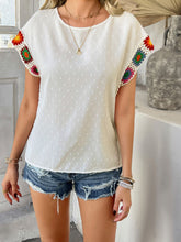 Model styled in white CrochetCharm Top with casual shorts, heels, a brown straw purse, and accessories for a complete look.