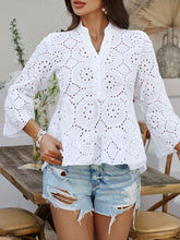 Model wearing Luméa™ Blouse in White, paired with distressed jeans and sandals at a summer brunch.