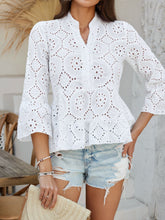 Model wearing Luméa™ Blouse in White, paired with distressed jeans and sandals at a summer pool party.