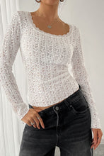 White long sleeve T-shirt with feminine lace accents at neckline and sleeves, styled casually for an elegant everyday look.