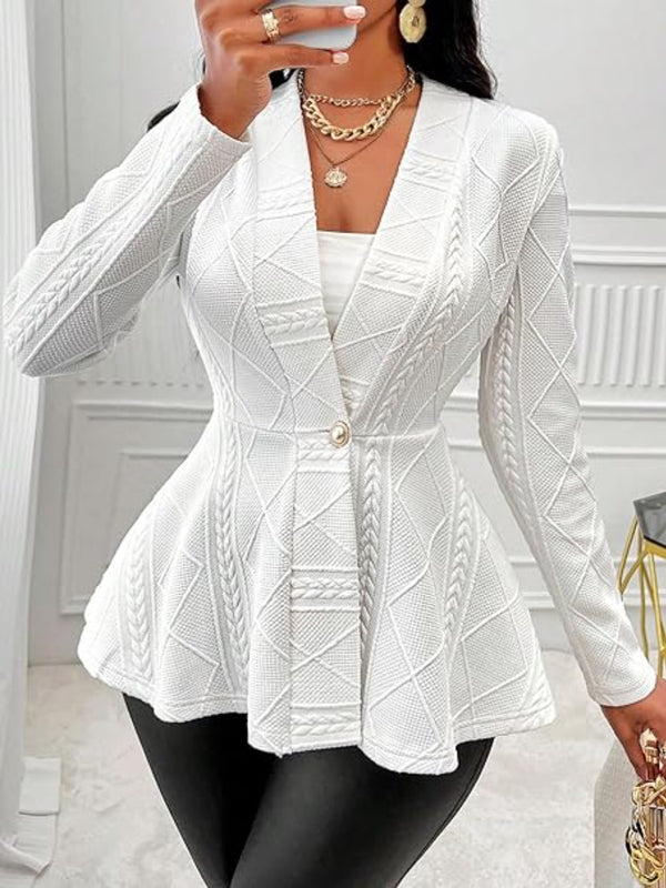 A woman taking a selfie photo at a restaurant wearing the white One Button Textured Peplum Cardigan paired with black leather pants, jewelry, and heels.