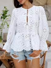 Boho-inspired beachside pose with model in PeplumMuse™ Blouse in White, paired with white distressed shorts, woven handbag, shell choker, and espadrille wedges.