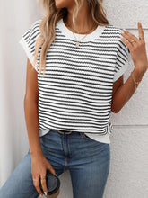 Model wearing Striped Round Neck Knit Top in white, paired with denim jeans for a chic casual daytime look.