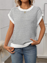 Side profile of model in white striped knit top, styled with white linen pants for an airy summer vibe.