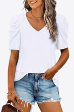 Model in white V-Neck Puff Sleeve Tee styled with accessories for a casual look.