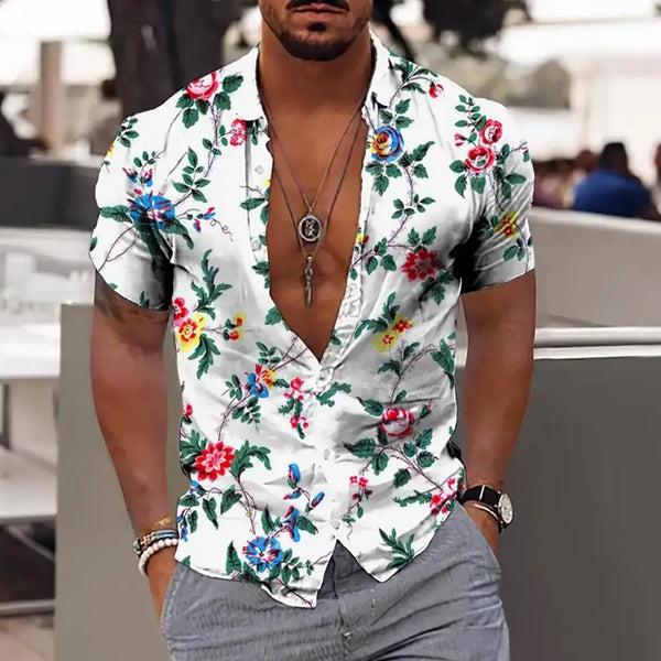 Model wearing White Rose Tropicscape Breeze Hawaiian Button-Up in vibrant floral print, front view.