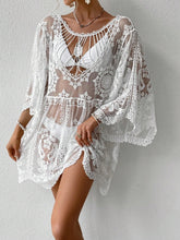 Model styled in white Celévra Lace Round Neck Cover-Up Dress poolside with sunglasses and woven accessories