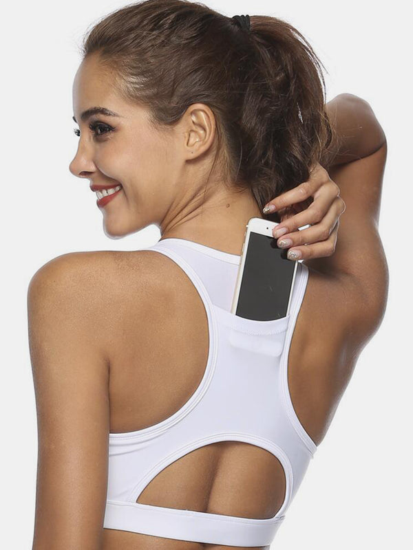 White cutout scoop neck active tank back view showing pocket.