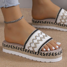 a model wearing a white pair of Geometric Weave Platform Sandals