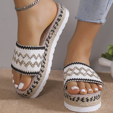 a model wearing a white pair of Geometric Weave Platform Sandals