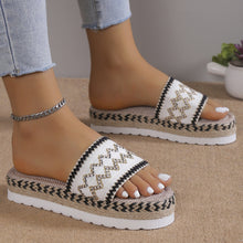 a model wearing a white pair of Geometric Weave Platform Sandals