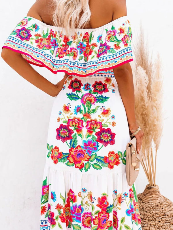 Back view of model in white Isadorae Floral Maxi Dress with ruffle neckline.