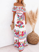 Model twirling in white Isadorae Floral Maxi Dress at a summer soirée.