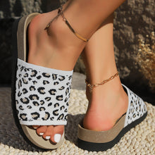 Model wearing white Leopard Open Toe Sandals, arched foot pose 