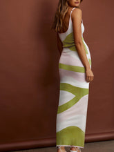 Back view of White Luxnometry Maxi Sweater Dress featuring intricate pattern detail inside an opulent mansion.