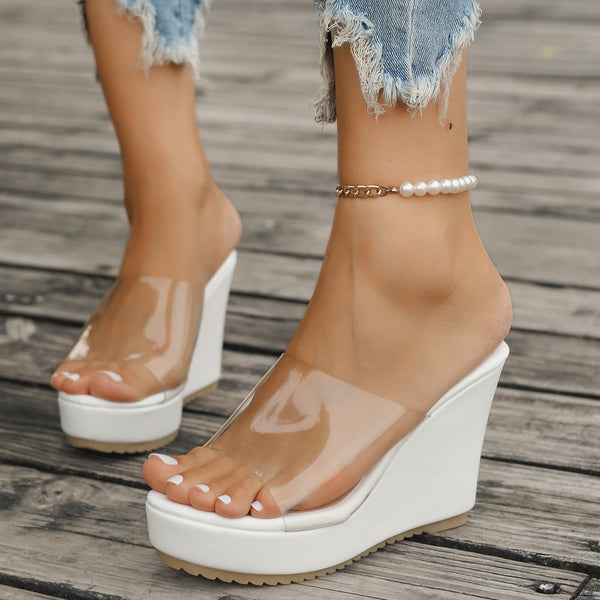 Model wearing white open toe Wedge Sandals paired with a white pearl bracelet