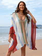 Close-up front view of white openwork color block plunge cover-up showing deep V neckline and texture detail