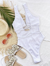 White ribbed lace-up one-piece swimsuit back flat lay view