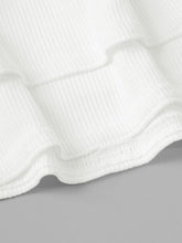 Close-up of White Rivéla Ruche Skirt ribbed texture and stitched layered ruffles