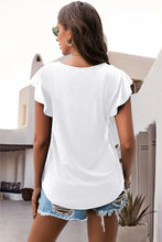 White ruffled round neck cap sleeve blouse back view
