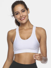 White cutout scoop neck active tank front view on model.