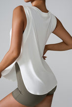 a woman modeling the back of the white Slit Round Neck Active tank top
