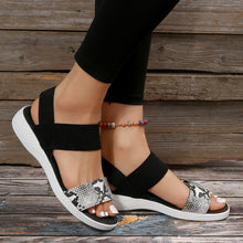 Model wearing White PU Leather Open Toe Low Heel Sandals in white snake skin, side view