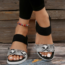 Model wearing PU Leather Open Toe Low Heel Sandals in white snake skin