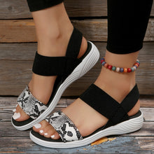 Model wearing white PU Leather Open Toe Low Heel Sandals in white snake skin