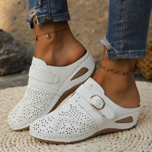 A model showcasing the side a pair of white Suede Round Toe Wedge Sandals with two golden anklets and ripped blue jeans highlighting the strap and gold buckle detail.