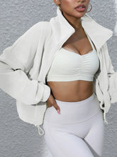 white turtleneck zip up jacket with gym wear