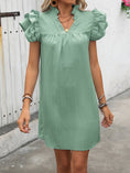 a woman modeling the Calivémuse™ Sage Ruffled Notched Cap Sleeve Mini Dress