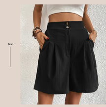 Women's black partial elastic high waist pleated baggy trouser shorts, front view.